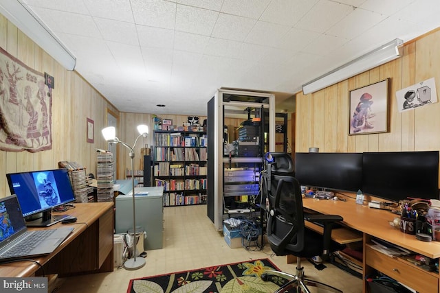 office space featuring wood walls