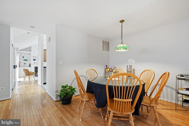 dining area with light hardwood / wood-style floors