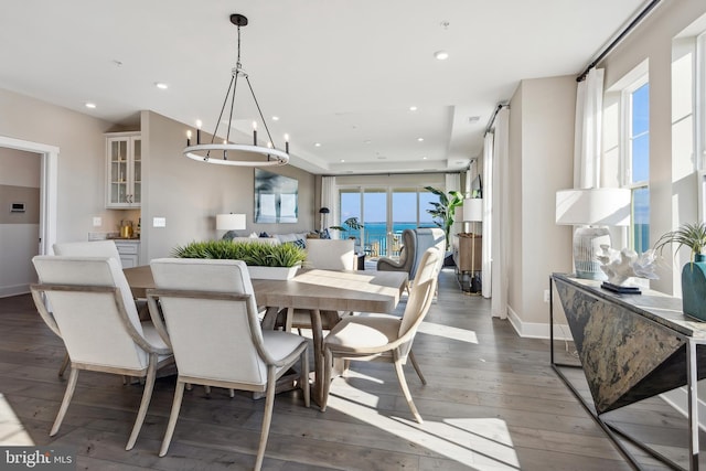 dining room featuring an inviting chandelier and dark hardwood / wood-style floors