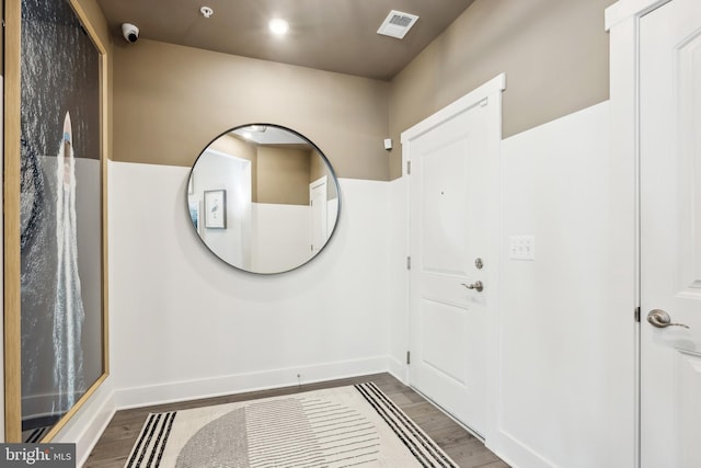 entryway with hardwood / wood-style floors