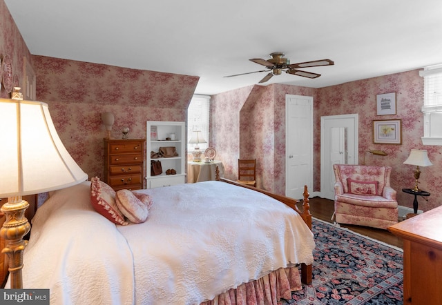 bedroom with wood-type flooring and ceiling fan