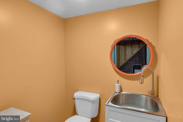 bathroom featuring sink and toilet