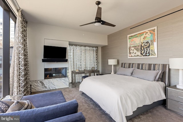 bedroom featuring ceiling fan and carpet flooring