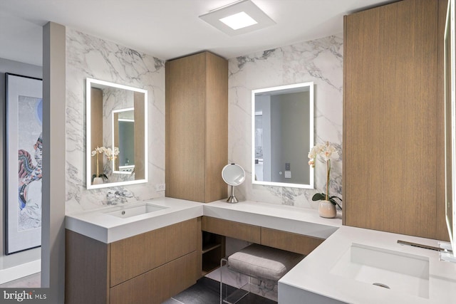 bathroom with vanity and decorative backsplash