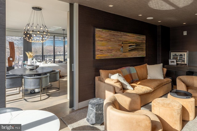 living room with a chandelier and light hardwood / wood-style floors