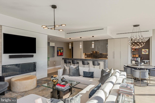 living room with an inviting chandelier