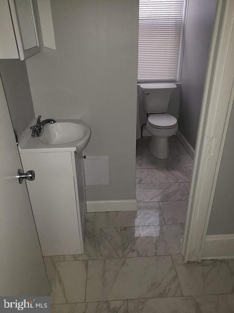 bathroom featuring vanity and toilet