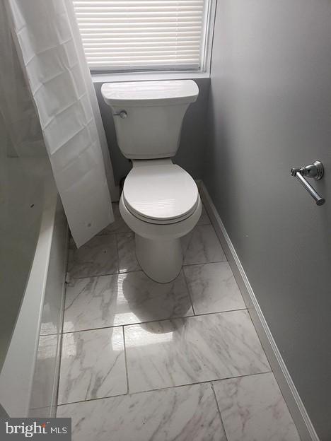 bathroom featuring toilet