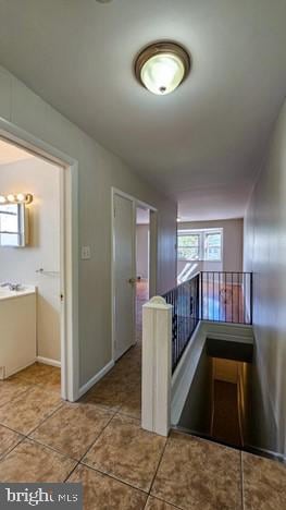 hallway featuring tile patterned floors