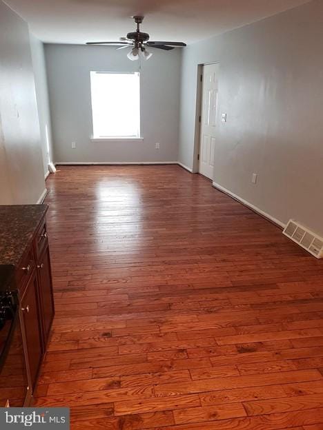 unfurnished room featuring hardwood / wood-style flooring and ceiling fan