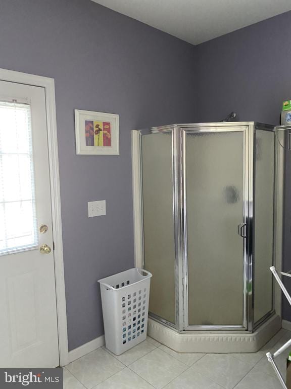 bathroom featuring tile patterned floors and walk in shower