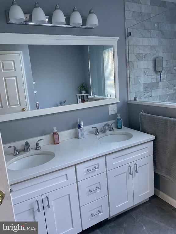 bathroom featuring vanity and walk in shower