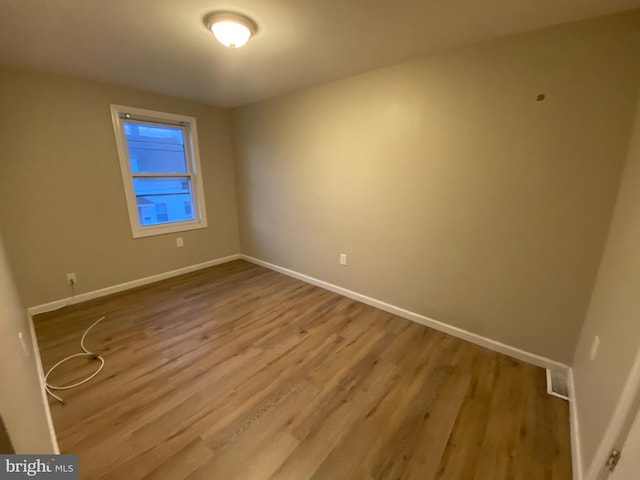 empty room featuring hardwood / wood-style floors