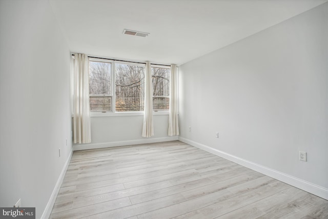 empty room with light wood-type flooring