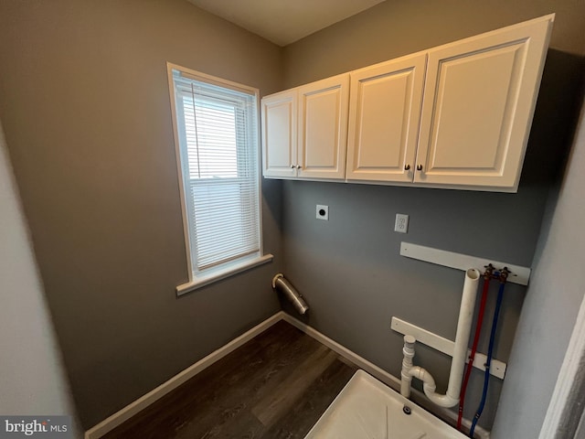 laundry room with cabinets, hookup for a washing machine, dark wood-type flooring, and hookup for an electric dryer