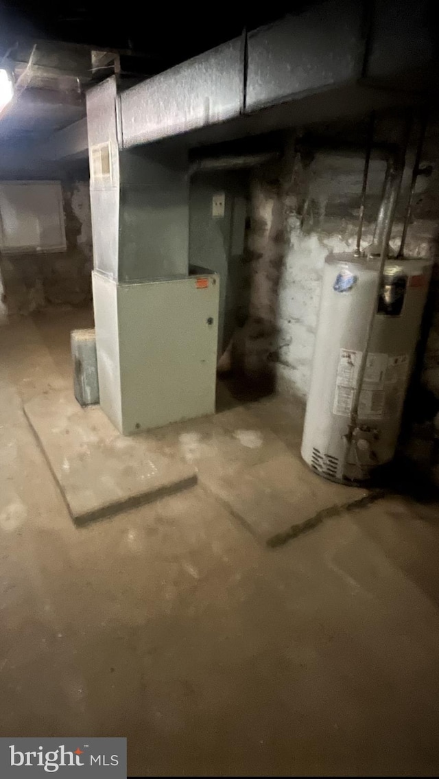 basement with heating unit and water heater