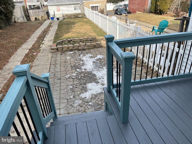 deck featuring a patio and a yard