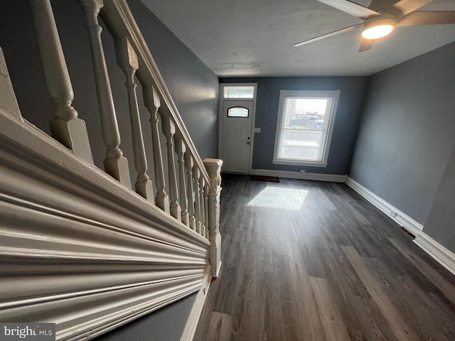 entryway with dark hardwood / wood-style floors and ceiling fan