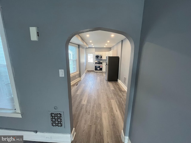 hallway featuring hardwood / wood-style flooring