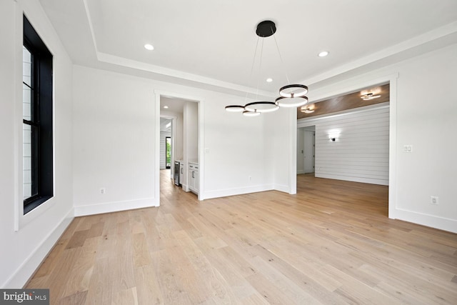 unfurnished dining area with baseboards, light wood-style flooring, and recessed lighting