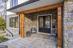 doorway to property featuring a patio area and french doors