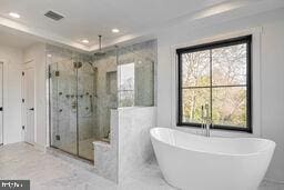 full bathroom with a stall shower, plenty of natural light, visible vents, and recessed lighting