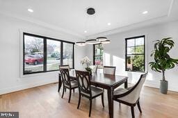 dining room with light wood-style floors, baseboards, and recessed lighting