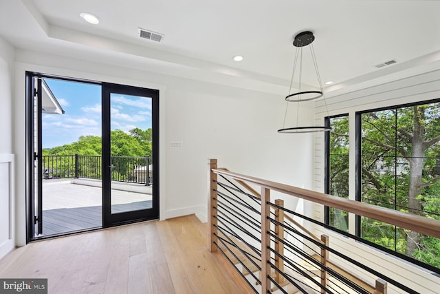 entryway with light wood-style flooring, visible vents, and recessed lighting