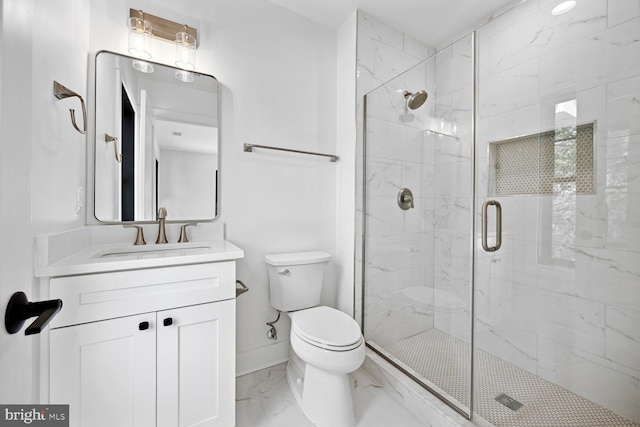 bathroom featuring baseboards, toilet, marble finish floor, vanity, and a shower stall