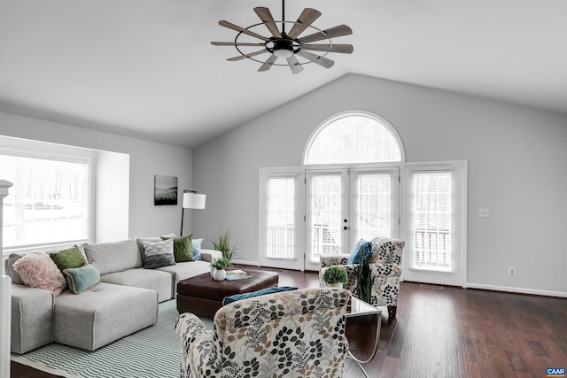 living room with dark hardwood / wood-style flooring, a wealth of natural light, and french doors