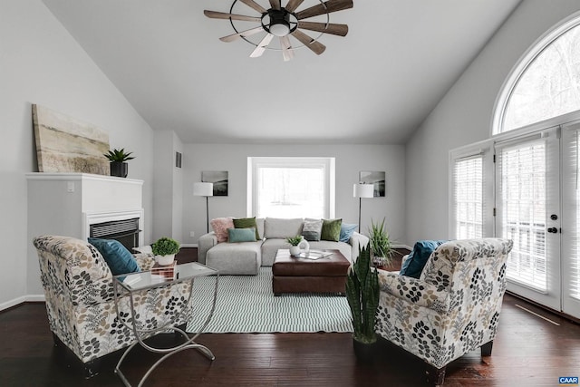 living room with vaulted ceiling, dark hardwood / wood-style floors, and a wealth of natural light