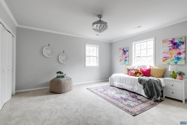 bedroom with crown molding, light colored carpet, and a closet