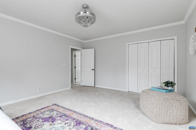 carpeted bedroom featuring crown molding and a closet