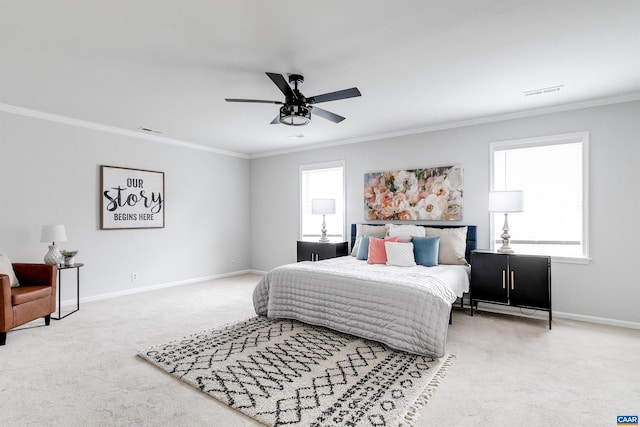 bedroom with ornamental molding, ceiling fan, and carpet flooring