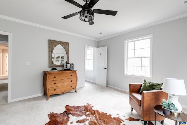 sitting room featuring a wealth of natural light, light colored carpet, and crown molding