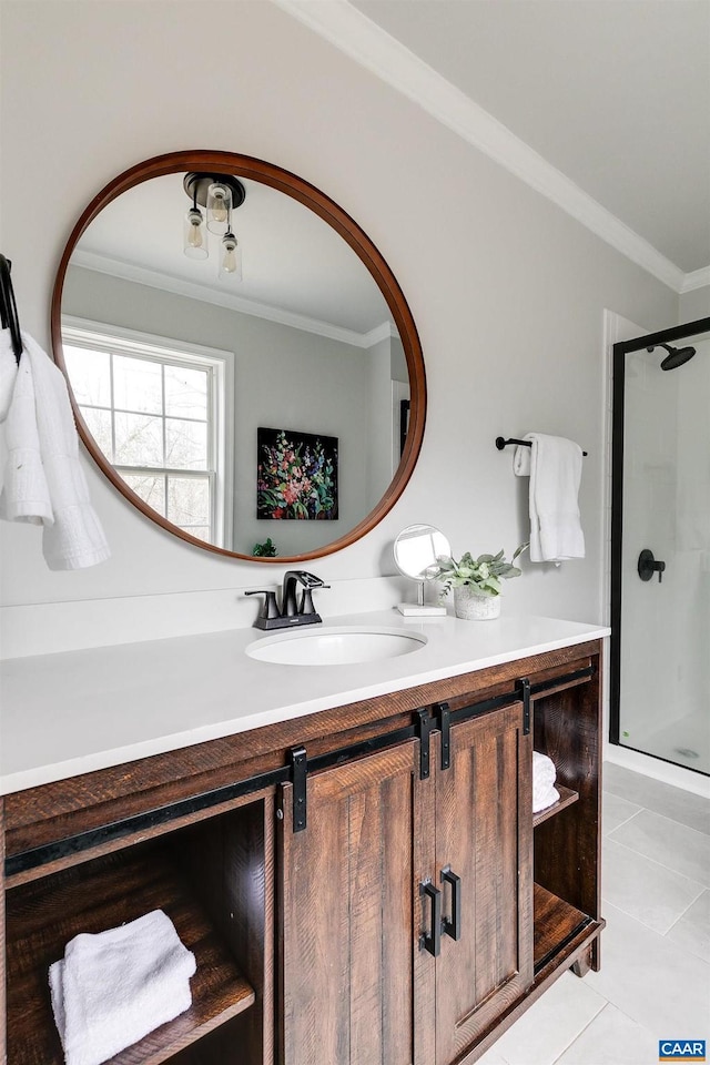 bathroom featuring tile patterned flooring, vanity, a shower with door, and ornamental molding