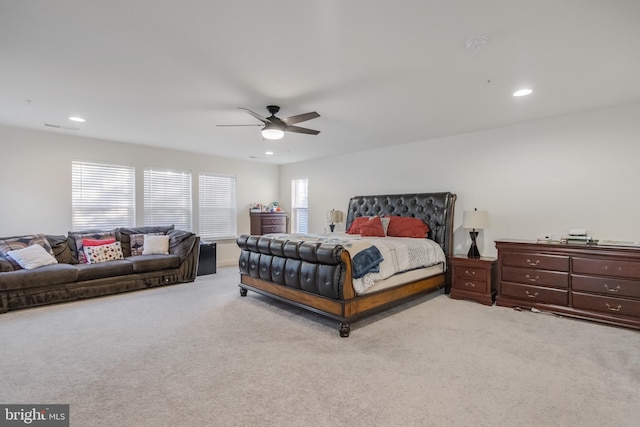 carpeted bedroom featuring a ceiling fan and recessed lighting