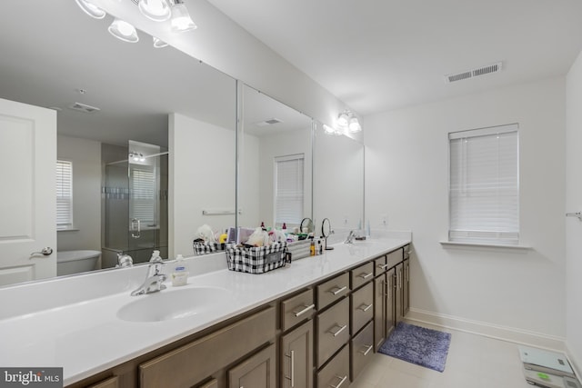 full bathroom featuring a stall shower, toilet, visible vents, and a sink