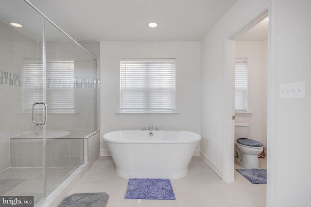 bathroom with a shower stall, toilet, recessed lighting, tile patterned floors, and a soaking tub