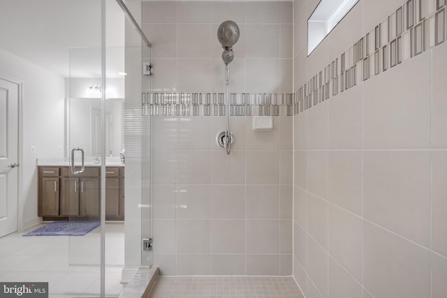 bathroom featuring vanity and a shower stall