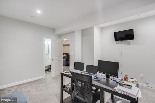 office area featuring recessed lighting, baseboards, and light carpet