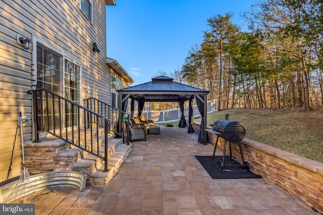 view of patio with a gazebo and a grill