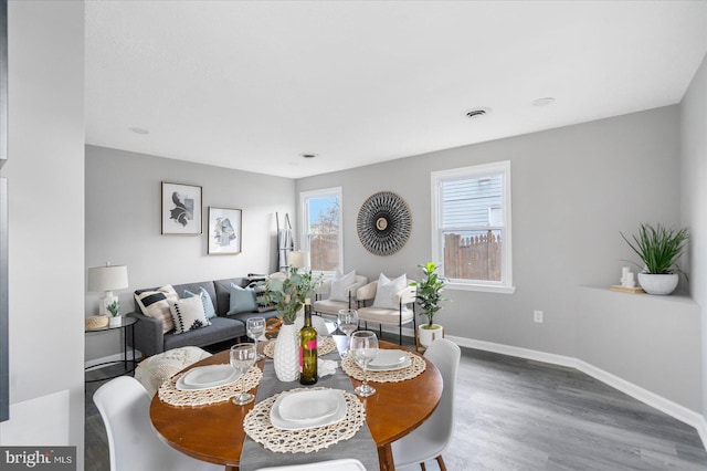 dining room with hardwood / wood-style floors