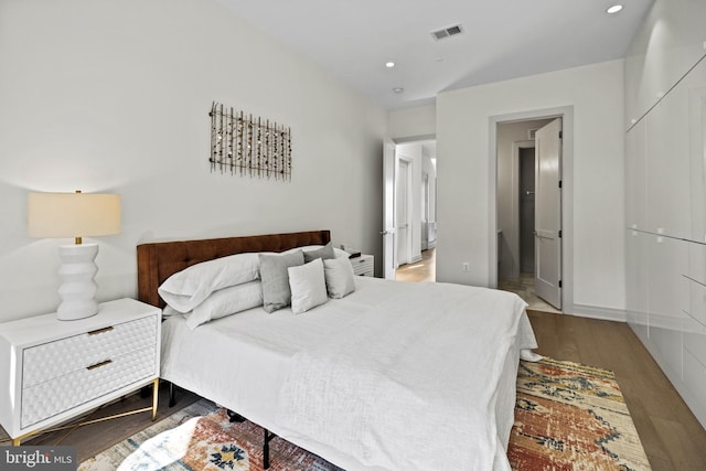 bedroom featuring hardwood / wood-style flooring