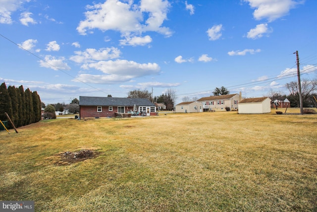 view of yard with a storage shed