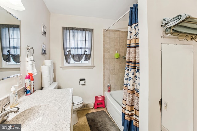 full bathroom with vanity, toilet, and shower / bath combo with shower curtain