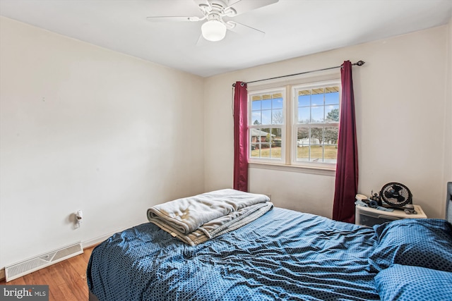 bedroom featuring ceiling fan and hardwood / wood-style floors