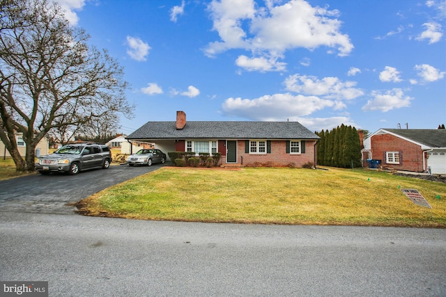 ranch-style home with a front yard