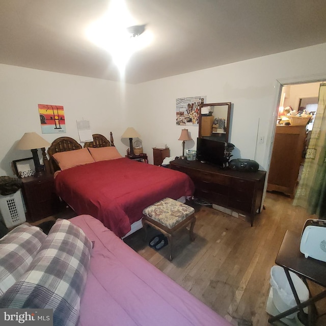 bedroom with hardwood / wood-style flooring