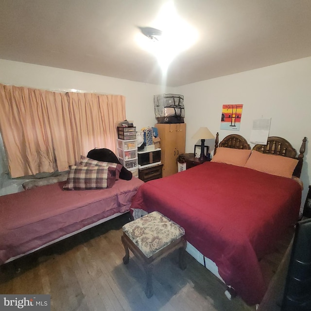 bedroom featuring dark hardwood / wood-style flooring